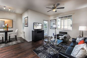 Furnished living room with wood plan style flooring